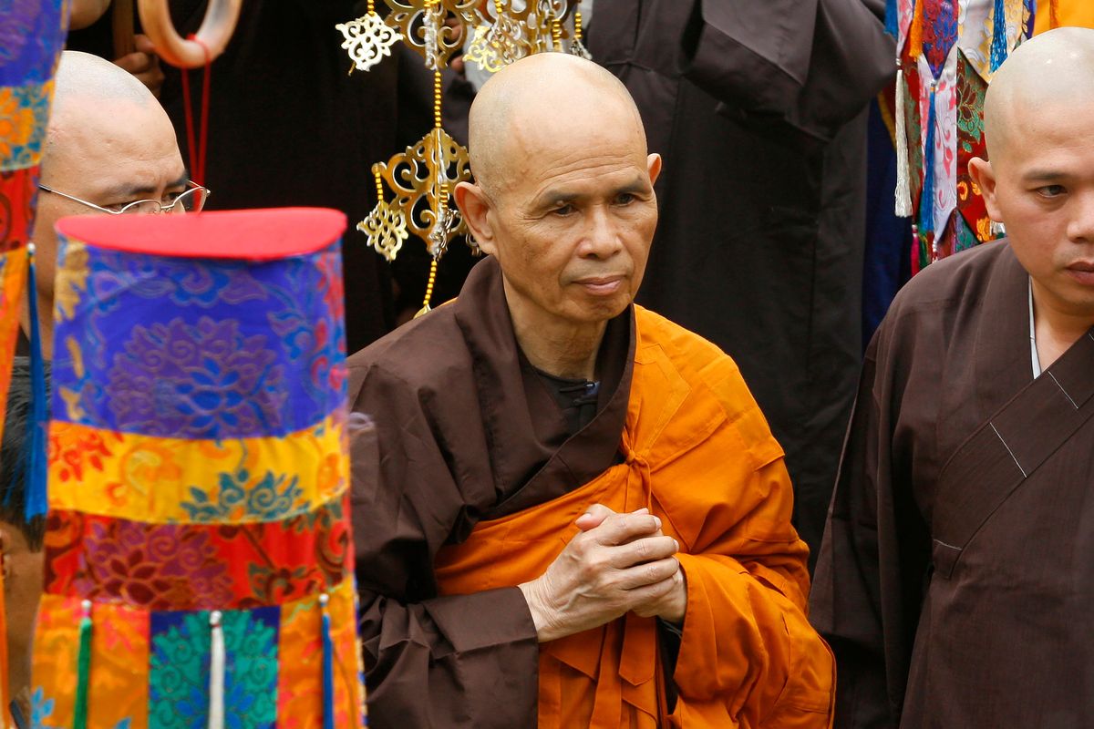 Vietnamese Zen master Thich Nhat Hanh, center, arrives for a great chanting ceremony at Vinh Nghiem Pagoda in Ho Chi Minh City, Vietnam on March 16, 2007. Zen Buddhist monk Thich Nhat Hanh, who helped pioneer the concept of mindfulness in the West and socially engaged Buddhism in the East, has died at age 95 on Saturday, Jan. 22, 2022, according to an announcement on his verified Twitter page.  (STR)