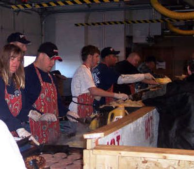 
Volunteer firefighters Lisa Hoyt, Ellen Fender, Chief Bryan Musser, Josh Wilkinson, Corey Stevens and Joe Kokinda serve at the 2007 Fisherman's Breakfast.
 (The Spokesman-Review)