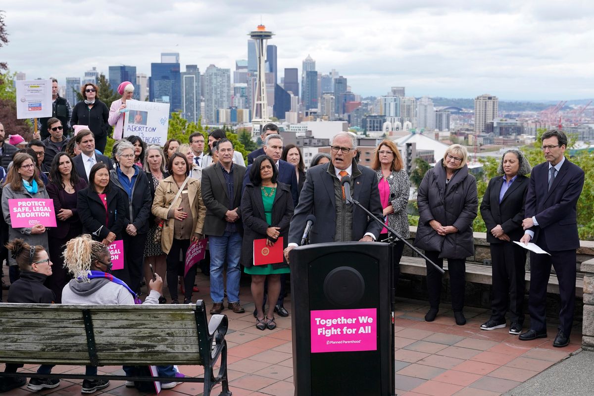 Washington Gov. Jay Inslee speaks Tuesday, May 3, 2022, at a rally at a park overlooking Seattle. Inslee said that Washington would remain a pro-choice state and that women would continue to be able to access safe and affordable abortions.  (Ted S. Warren/Associated Press)