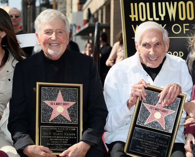 Sid Krofft, left, and Marty Krofft with their stars for the Hollywood Walk of Fame on Feb. 13, 2020, in Hollywood, Calif.  (David Livingston/Getty Images North America/TNS)