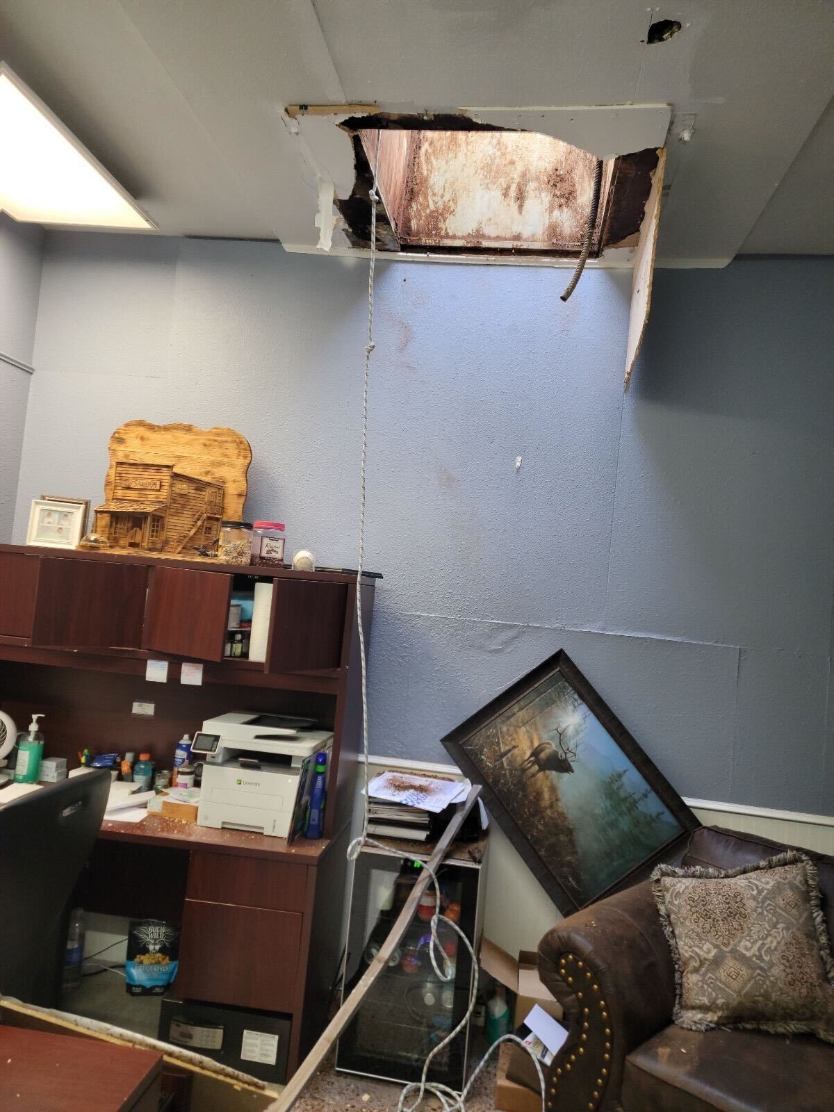 Thieves broke in through a vent at Northtown Auto Sales Tuesday morning and rappelled down into an office with a rope. They stole nine cars.  (Courtesy of Johnny Arrotta)