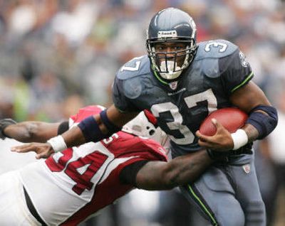 
Seattle running back Shaun Alexander was held to 89 yards on 26 carries against Arizona on Sunday.
 (Associated Press / The Spokesman-Review)