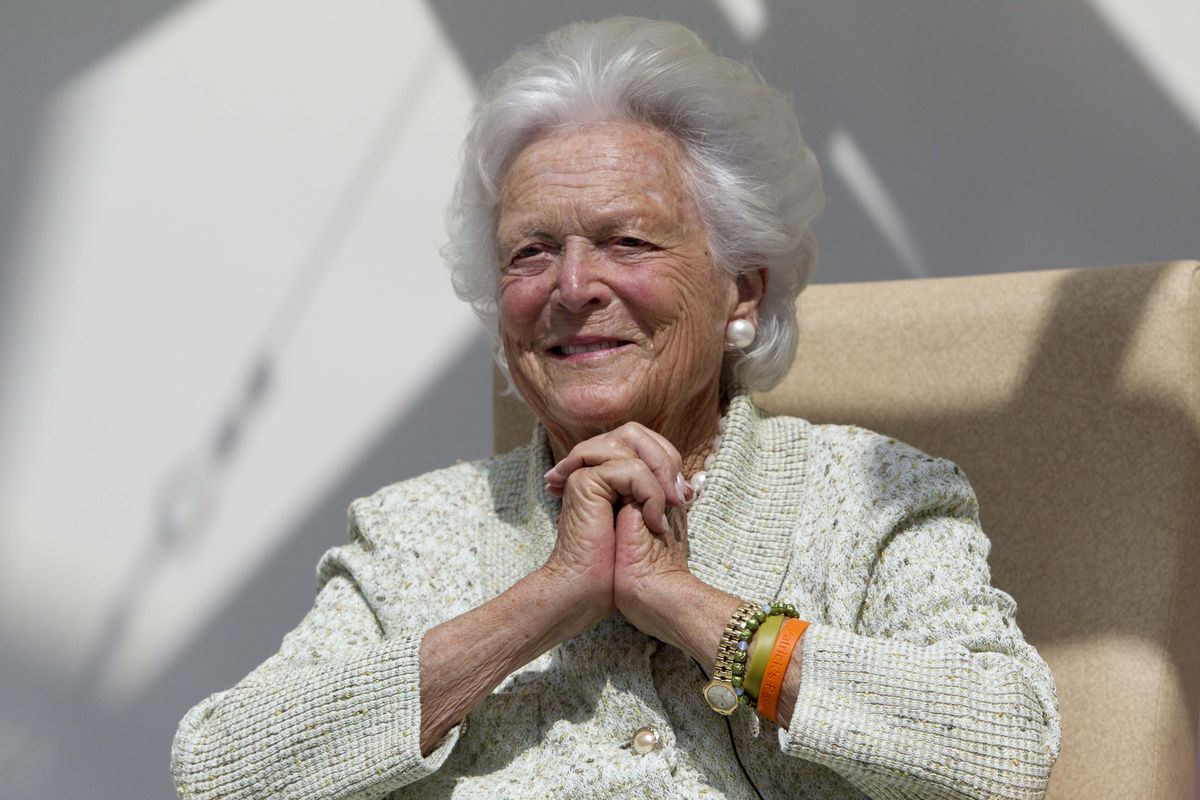 Former first lady Barbara Bush listens to a patient