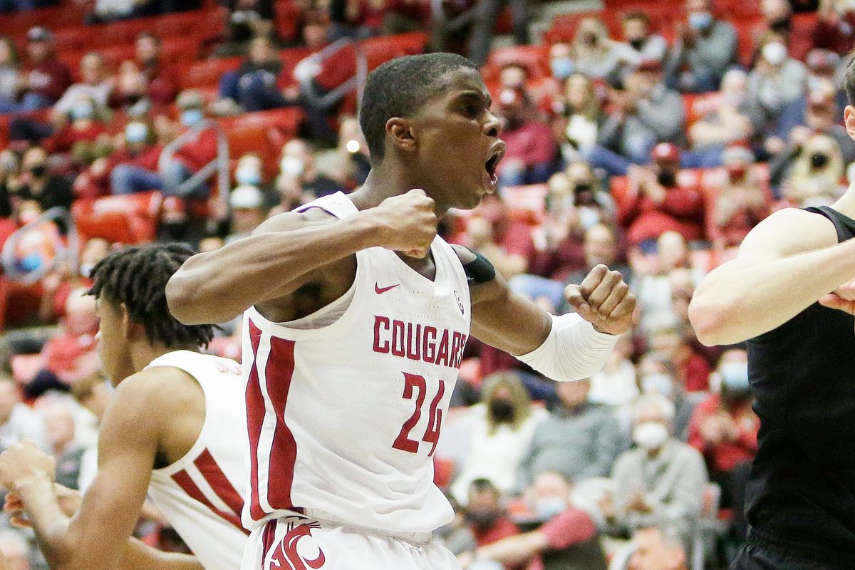 Washington State guard Noah Williams celebrates his basket against the USC Trojans on Saturday in Pullman.  (Young Kwak)