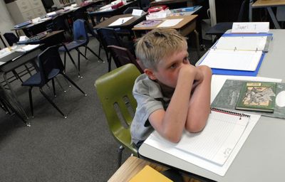 Fifth-grader Jaryd Kenney-Ilg  stayed in his classroom rather than go to recess  Aug. 12 and tried to remember what book he read over the  summer. Tuesday was the first day of school for the Continuous Cirriculmum School  in East Valley.  (J. BART RAYNIAK / The Spokesman-Review)