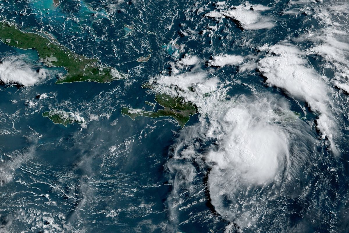 This satellite image provided by the National Oceanic and Atmospheric Administration (NOAA) shows a Tropical Storm Fred in the Caribbean as it passes south of Puerto Rico and the Dominican Republic at 8am EST, Wednesday, Aug. 11, 2021.  (HOGP)