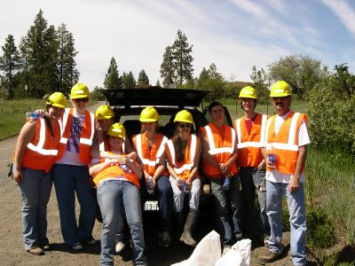 Stacy Sainsbury, Chelsa Ayers, Hanna Weathers, Felicity Weathers, Danny Cossey, MacKenzie DeRuyter, Travis Sorensen, Josh Grandinetti and adviser Scott Moore take a break as they clean up a two-mile stretch of Highway 27 through the DOT “Adopt a Highway” program. Photo courtesy of Scott Moore (Photo courtesy of Scott Moore / The Spokesman-Review)