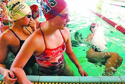 
From left, Emri Moore, Maggie Thompson and Jenni Dole,  all members of the Spokane Area Swimming Club, go through their  warm-up laps at the Shadle Park pool  for the last time Friday. 
 (Ingrid Lindemann / The Spokesman-Review)