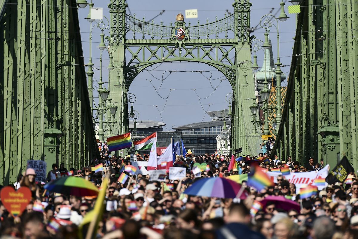 People march across the Szabadsag, or Freedom Bridge over the River Danube in downtown Budapest during a gay pride parade in Budapest, Hungary, Saturday, July 24, 2021. Rising anger over policies of Hungary