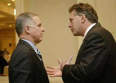 
 Howard Dean, , a candidate for chairman of the Democratic National Committee, talks with the current chairman, Terry McAuliffe, on Jan. 18 in Washington.
 (Associated Press / The Spokesman-Review)