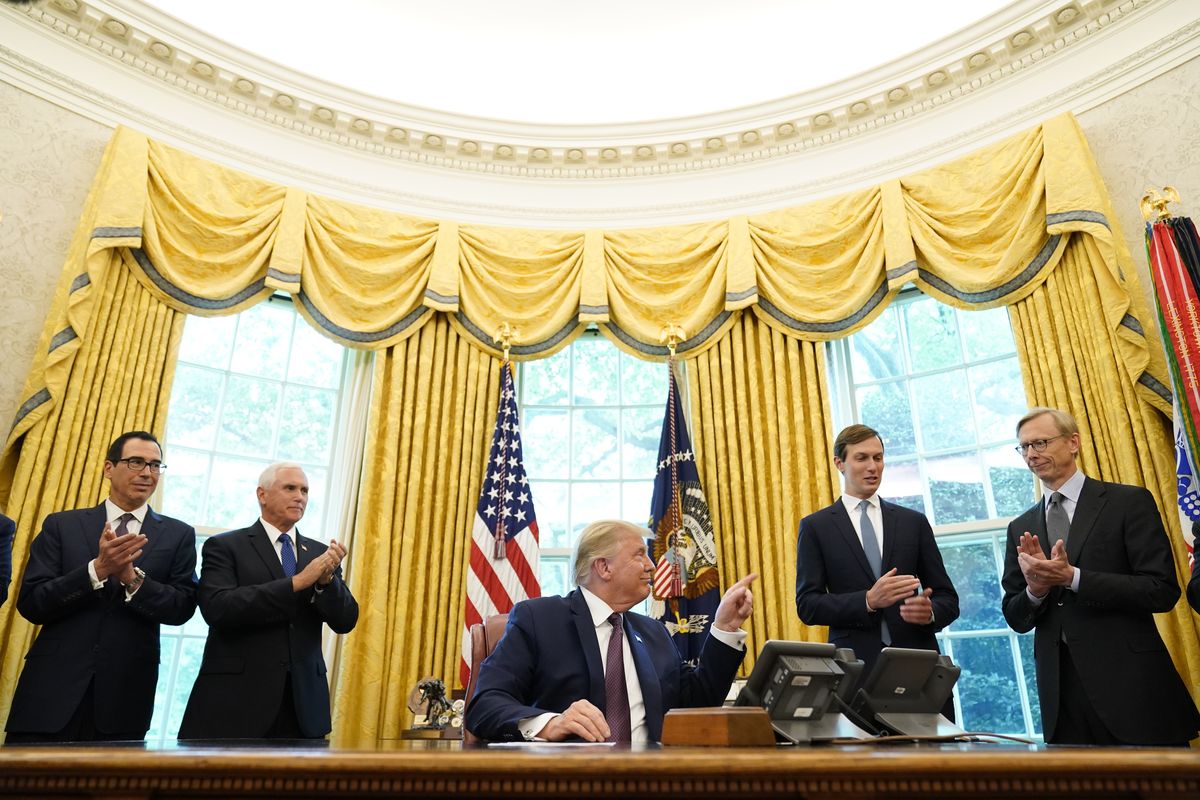 President Donald Trump speaks in the Oval Office of the White House on Friday, Sept. 11, 2020, in Washington. Bahrain has become the latest Arab nation to agree to normalize ties with Israel as part of a broader diplomatic push by Trump and his administration to fully integrate the Jewish state into the Middle East. From left, Treasury Secretary Steven Mnuchin, Vice President Mike Pence, Trump, Jared Kushner and U.S. special envoy for Iran Brian Hook.  (Associated Press)