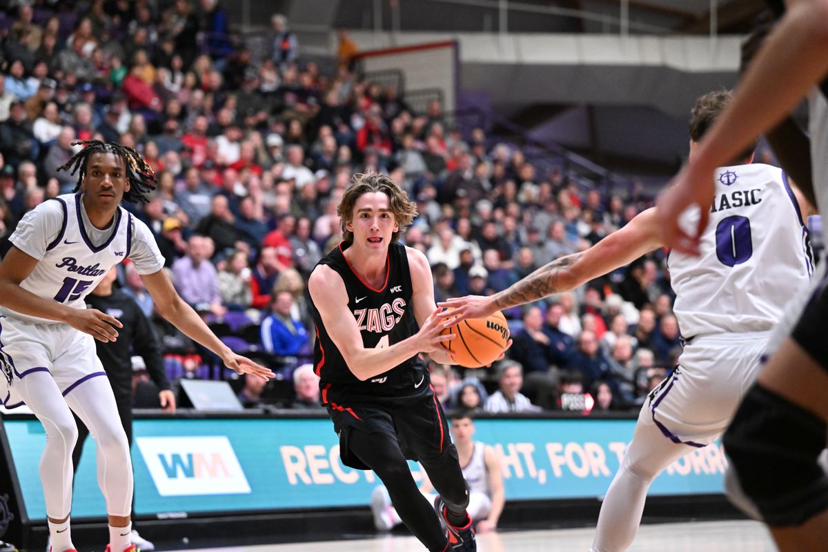 Gonzaga’s Dusty Stromer drives to the hoop against the Portland Pilots on Thursday at the Chiles Center in Portland.  (By Tyler Tjomsland/The Spokesman-Review)
