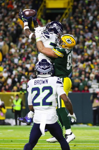 Seattle Seahawks’ Jamal Adams intercepts a pass on Nov. 14, 2021, at Lambeau Field in Green Bay, Wisconsin.  (Tribune News Service)