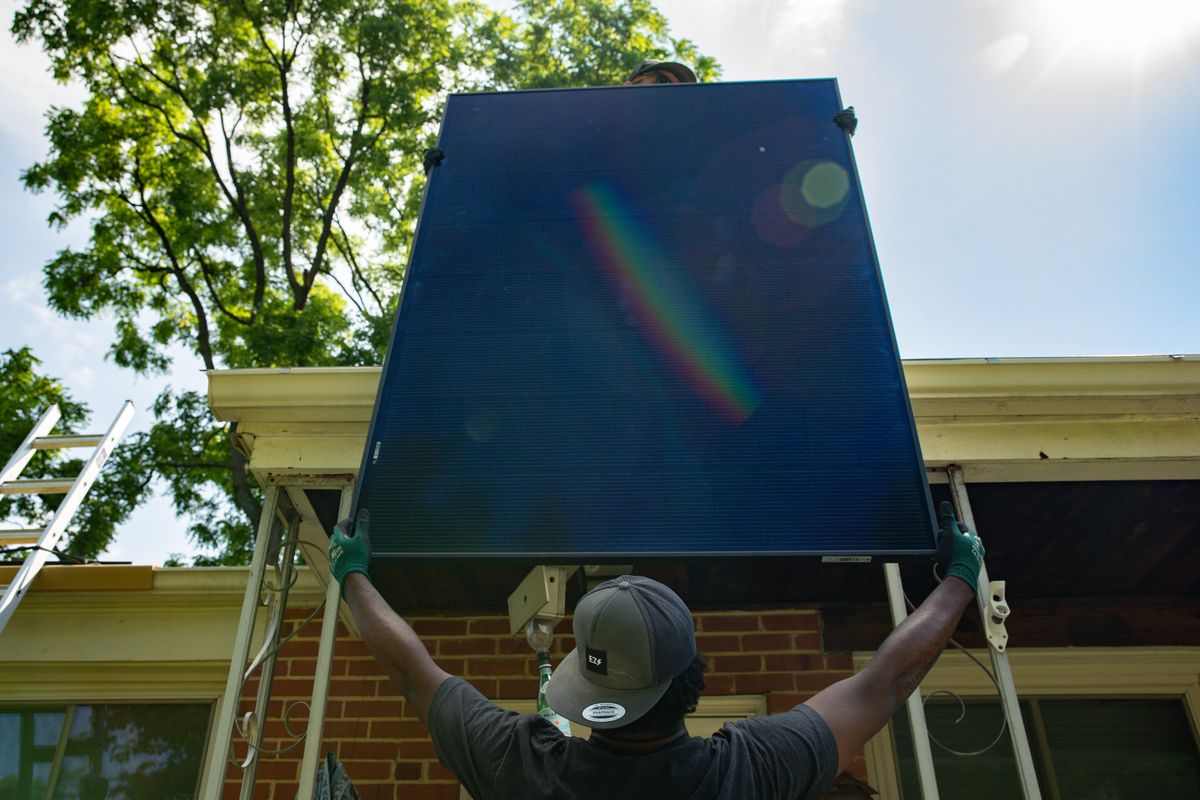 KJ Williams, installer with Lumina Solar, begins working on a home in Kensington, Maryland. (The Washington Post)