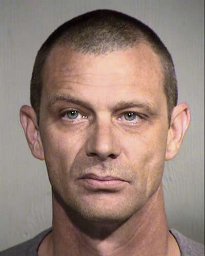 This undated photo provided by the Maricopa County Sheriff’s office shows Matthew Disbro. Arizona authorities say the 44-year-old uniformed security guard is accused of impersonating a police officer by trying to pull over an unmarked car that happened to contain two state troopers patrolling a Phoenix freeway. (uncredited / Associated Press)