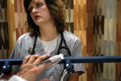 
Dr. Tiffany Kuehl examines a patient in the Deaconess Medical Center emergency room Oct. 31. Kuehl is part of a group trying to start a Sexual Assault Nurse Examiners (SANE) program in Spokane. 
 (Photos by Jed Conklin / The Spokesman-Review)