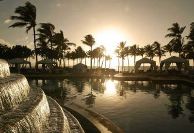 
A view of the sun setting poolside from the Grand Wailea Resort Wailea, Maui, is an impressive sight.
 (Associated Press / The Spokesman-Review)
