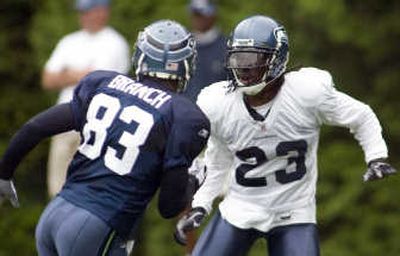 
Marcus Trufant, right, defends Deion Branch during camp earlier this month. Associated Press
 (Associated Press / The Spokesman-Review)
