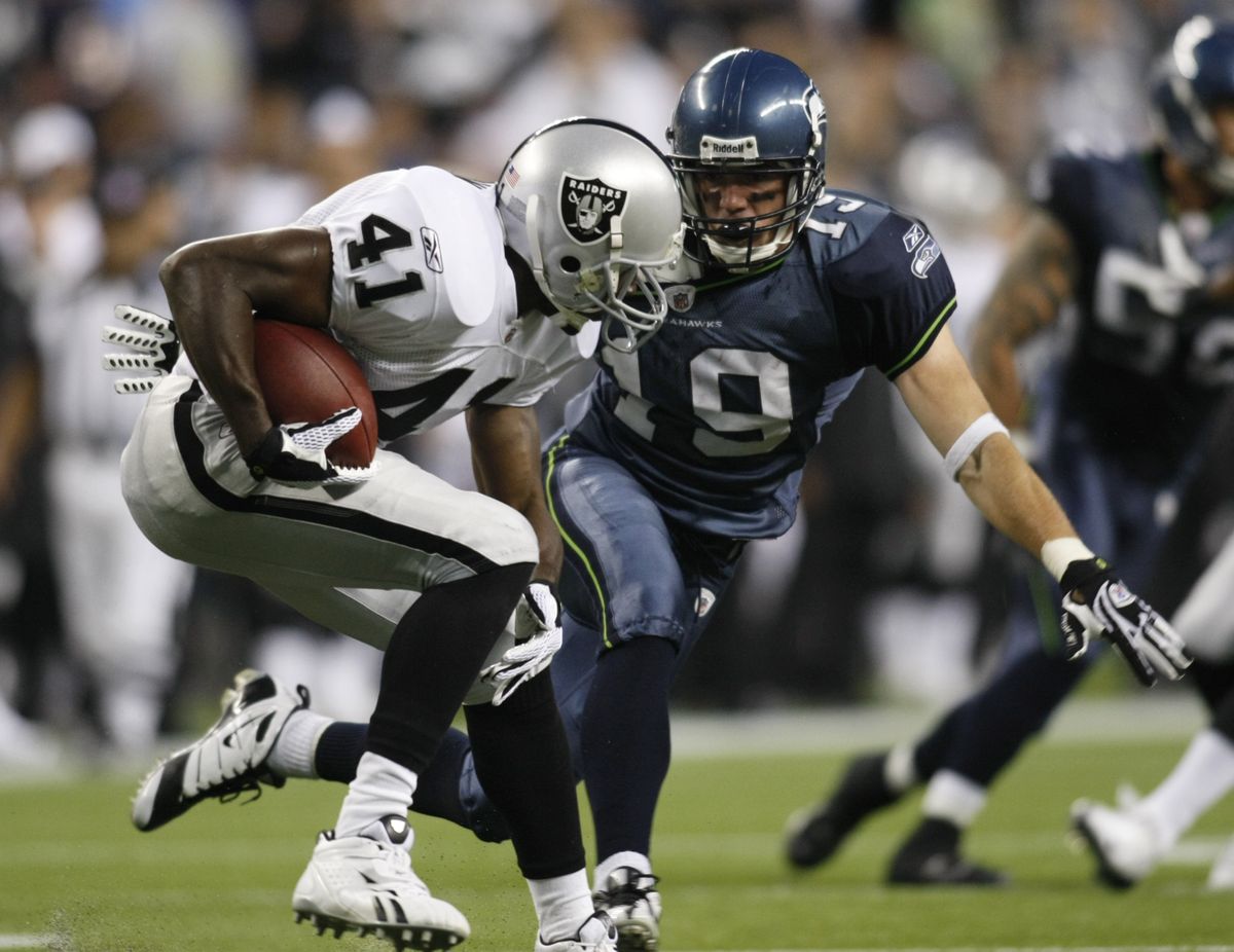 Raiders’ Louis Rankin tries to step away from Seahawks’ Logan Payne on a kick return in team’s last preseason game. Associated Press photos (Associated Press photos / The Spokesman-Review)