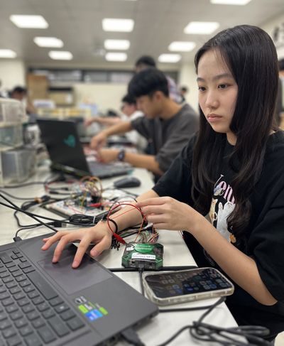 Wei Yu-han, 19, works on a project in the electronics engineering lab at National Yang Ming Chiao Tung University.  (Stephanie Yang/Los Angeles Times/TNS)