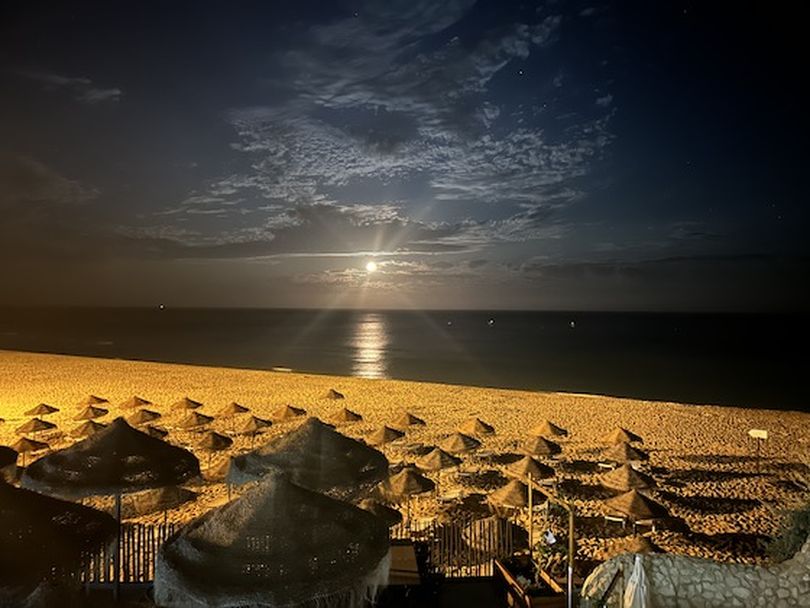 The full moon shines bright over the beach that Rick Steves thinks could be Europe's