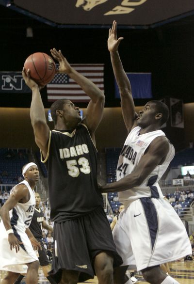 Idaho’s Marvin Jefferson shoots against the defense of Nevada’s Dario Hunt. (Associated Press)