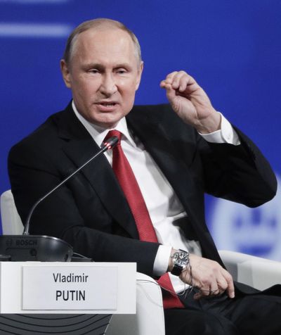 Russian President Vladimir Putin  speaks at the  International Economic Forum in St. Petersburg, Russia, Friday, June 2, 2017. Putin says the chemical attack in Syria was provocation to frame Assad. (Dmitry Lovetsky / Associated Press)