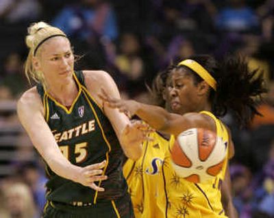 
Seattle's Lauren Jackson, left, passes around the Sparks' Jessica Moore.Associated Press
 (Associated Press / The Spokesman-Review)