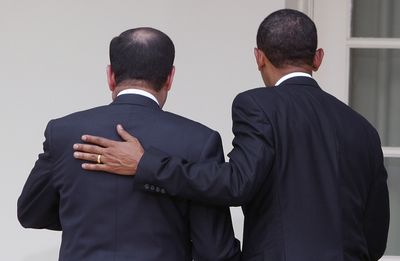 President Barack Obama puts his arm on Iraqi Prime Minister Nouri al-Maliki following a news conference at the White House on Wednesday.  (Associated Press / The Spokesman-Review)