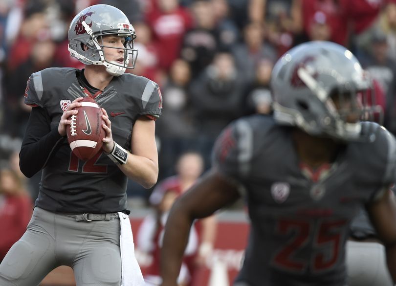WSU quarterback Connor Halliday (12) looks for an opening against Arizona during the first half of a college football game on Saturday, October 25, 2014, at Martin Stadium in Pullman, Wash. (Tyler Tjomsland / The Spokesman-Review)