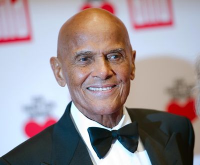 FILE - In this Dec. 6, 2014 file photo, Harry Belafonte arrives at the charity gala Ein Herz fuer Kinder (A heart for children) in Berlin. Belafonte is hoping to lead the charge with his Many to Rivers Cross festival, a racial and social justice event debuting Oct. 1-2. It's an extension of his social justice organization Sankofa.org, which Belafonte established in 2013. (Steffi Loos / AP)