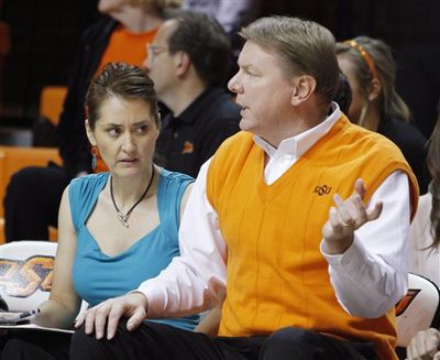 This Nov. 9 photo shows Oklahoma State University women's basketball coach Kurt Budke and assistant coach Miranda Serna during an an exhibition women's NCAA college basketball game against Fort Hays State, in Stillwater, Okla. The university said Budke and Serna were killed when the single-engine plane they were riding in during a recruiting trip crashed Thursday night.  (Associated Press)