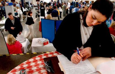 
Andrea Giovanelli of Coeur d'Alene filled out at least 10 applications during Job Fair. 
 (Kathy Plonka / The Spokesman-Review)