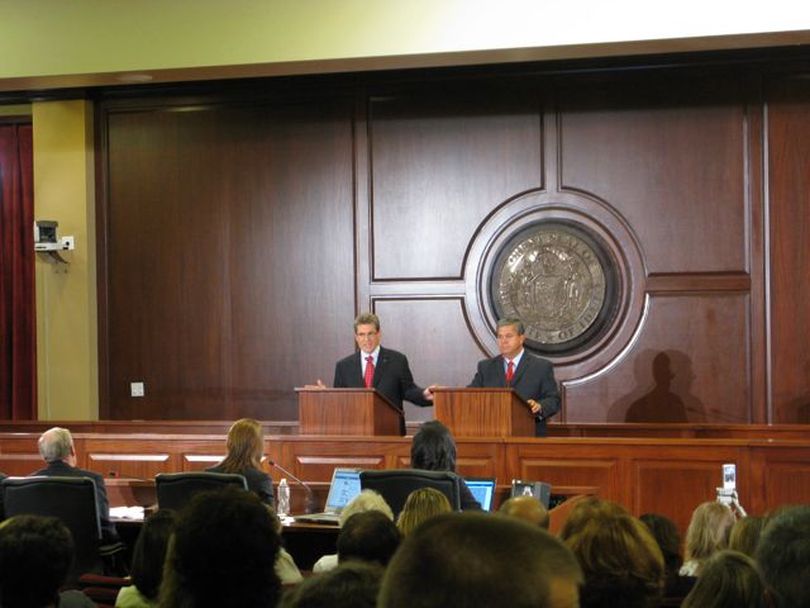 Democratic challenger Stan Olson, left, takes a rhetorical swipe at incumbent Idaho state Superintendent of Schools Tom Luna, right, as the two debated on live statewide TV on Tuesday night. The debate was sponsored by the League of Women Voters and the Idaho Press Club and broadcast statewide on Idaho Public Television. (Betsy Russell)