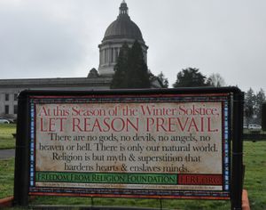 A sign marking the Winter Solstice, erected by the Freedom From Religion Foundation, is up on the Capitol campus as part of the annual duel over holiday-time displays. A Nativity Scene is also up, about 50 yards to the south. (Jim Camden)