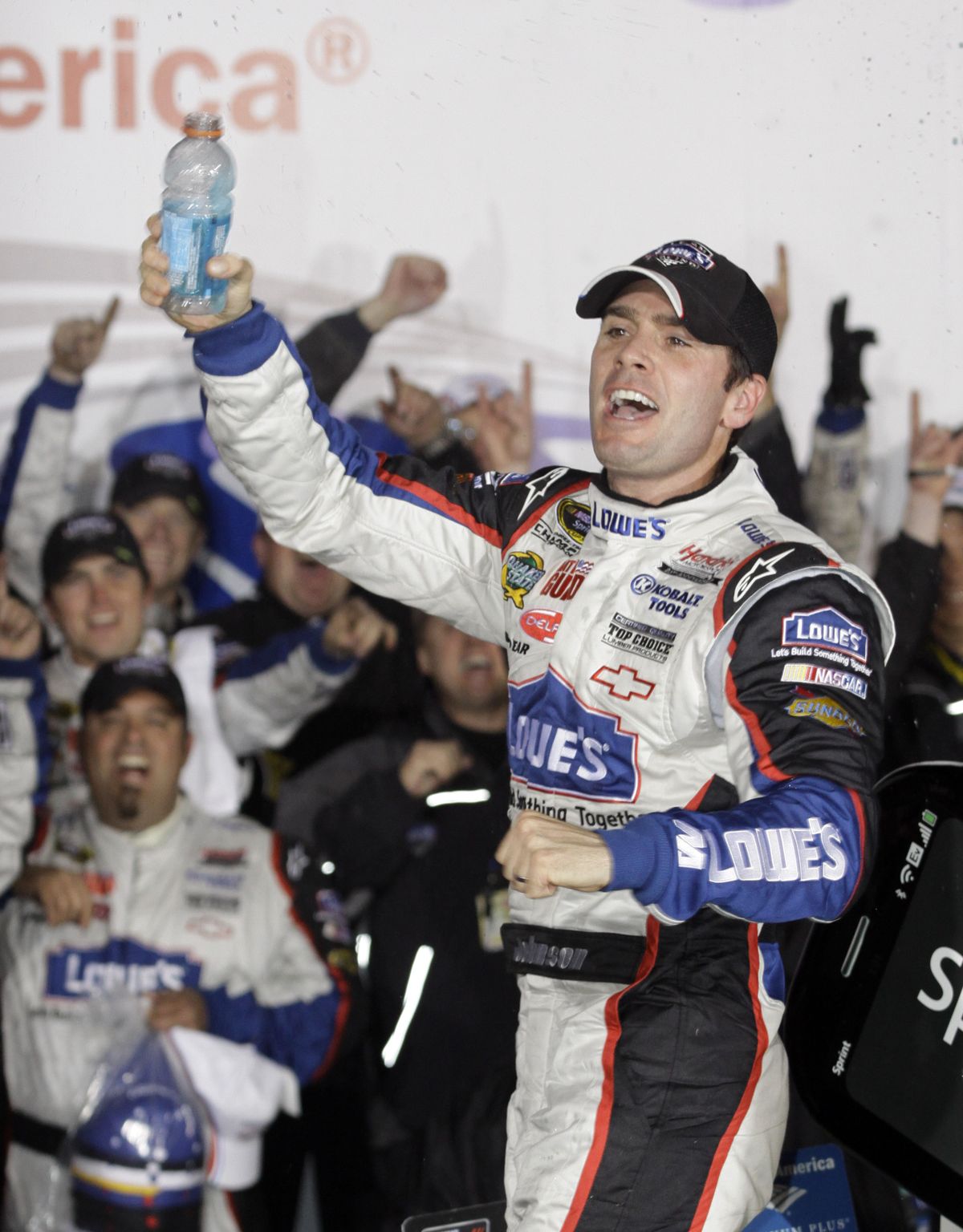 Johnson celebrates in victory lane after end of amazing weekend.  (Associated Press / The Spokesman-Review)