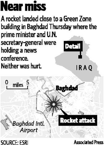 
Journalists duck as bodyguards  move to protect Iraqi Prime Minister Nouri al-Maliki, center left, and U.N. Secretary-General Ban Ki-moon  when a mortar round landed   roughly 50 yards from their press conference in Baghdad on Thursday. 
 (The Spokesman-Review)