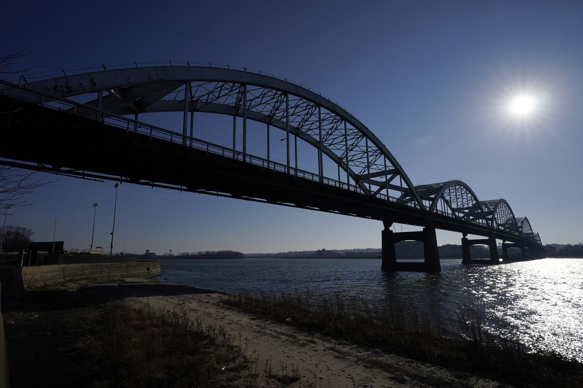 The Centennial Bridge is seen over the Mississippi River, Monday, Dec. 20, 2021, in Davenport, Iowa. The 81-year-old bridge creaks under the weight of tens of thousands of cars and trucks every day and rust shows through its chipped silver paint, exposing the steel that needs replacing. This city