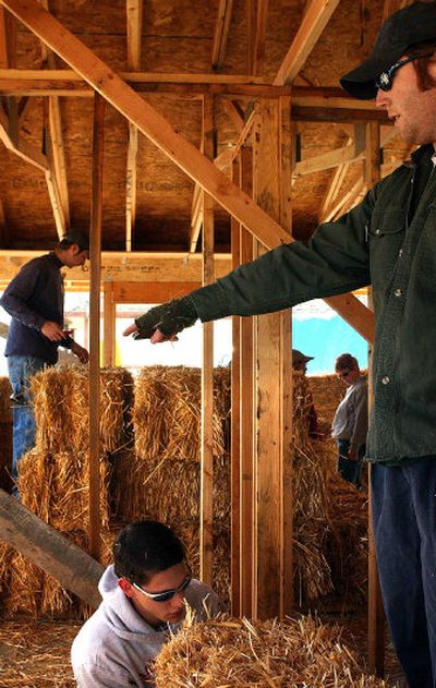 
Volunteers for Habitat for Humanity, an organization that helps families in need build homes, work on the organization's first straw bale house, on North Waldo Road, on Saturday. 
 (Jed Conklin / The Spokesman-Review)