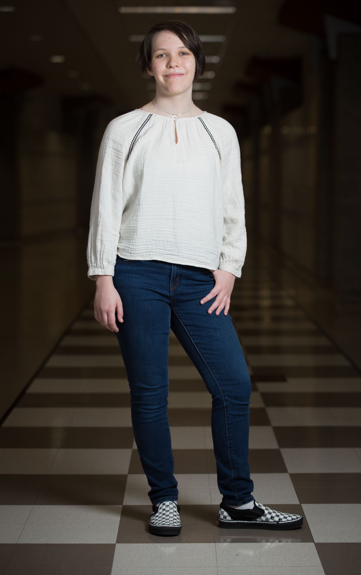 Emily Neff is graduating with the University High School senior class. Here she takes a portrait inside the school on April 27. Neff, who grew up in Germany, said she appreciates being able to take classes at U-Hi that she wouldn’t have had an opportunity to take at her high school in Germany. Graphic arts is one of them.  (Libby Kamrowski/ THE SPOKESMAN-R)