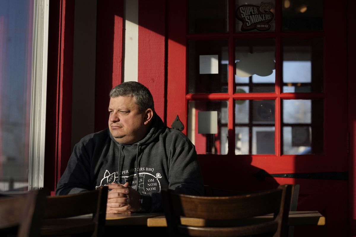 Jeff Fitter, owner of Super Smokers BBQ, poses for a photo inside his restaurant Thursday, Jan. 28, 2021, in Eureka, Mo. Fitter says his profits were down by about half last year, largely because of the closures and capacity limits imposed by St. Louis County. He is supporting a bill that would limit local emergency health orders to 14 days unless authorized for longer by the Legislature.  (Jeff Roberson)