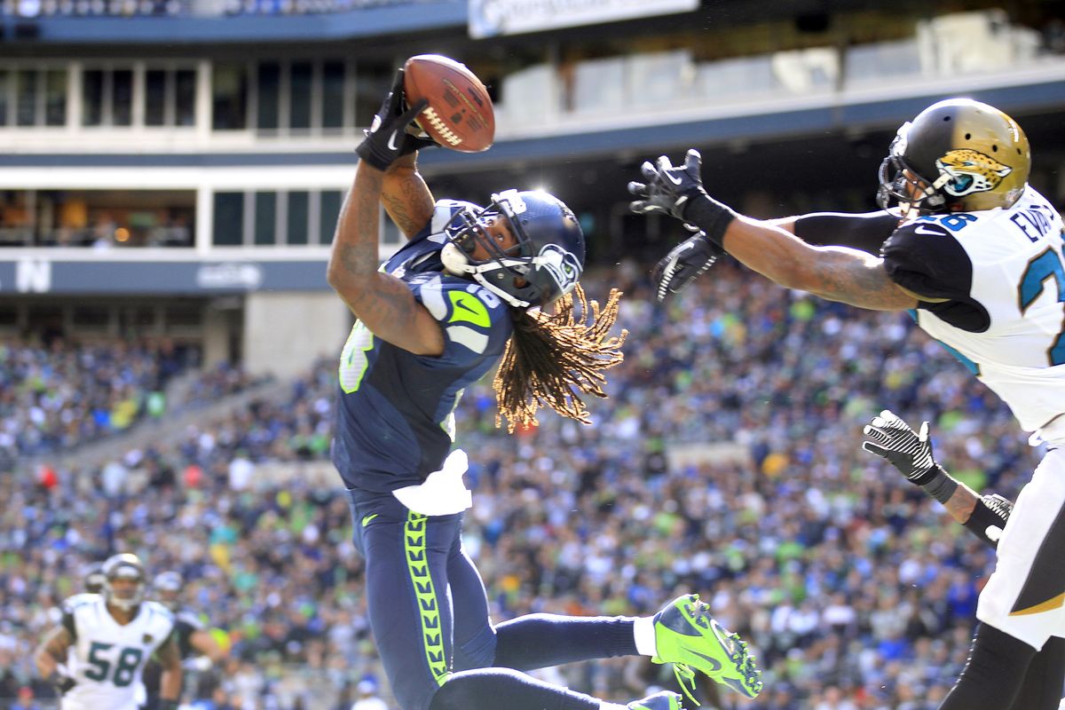 Seattle Seahawks wide receiver Sidney Rice, left, snags the ball in the end zone for a touchdown in front of Jacksonville defensive back Josh Evans. Rice caught 5 passes for 79 yards and 2 touchdowns in Sunday