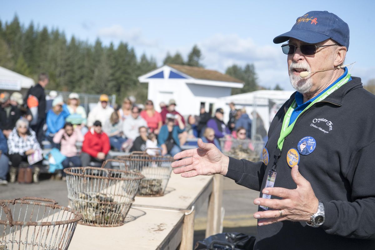 Mike Barnard, a retired surgeon who emcees the annual West Coast Oyster Shucking Competition, briefs the crowd gathered to watch the speed shucking contest Saturday, Oct. 7, 2017 at Oysterfest in Shelton, Wash. (Jesse Tinsley / The Spokesman-Review)