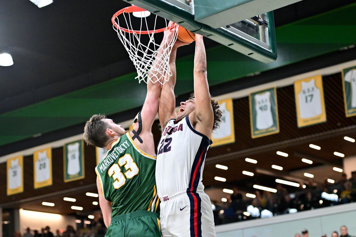 Gonzaga Bulldogs forward Anton Watson (22) dunks the ball against San Francisco Dons center Volodymyr Markovetskyy (33) to tie the game late during the second half of a college basketball game on Thursday, Jan. 5, 2023, at War Memorial Gym in San Francisco, Calif. Gonzaga won the game 77-75.  (Tyler Tjomsland/The Spokesman-Review)