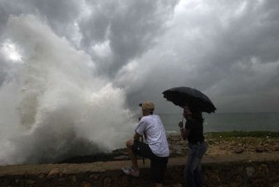 
Waves produced by Tropical Storm Ernesto pounded the beach Saturday at Santo Domingo, Dominican Republic. Ernesto could enter the Gulf of Mexico within days as a hurricane.
 (Associated Press / The Spokesman-Review)