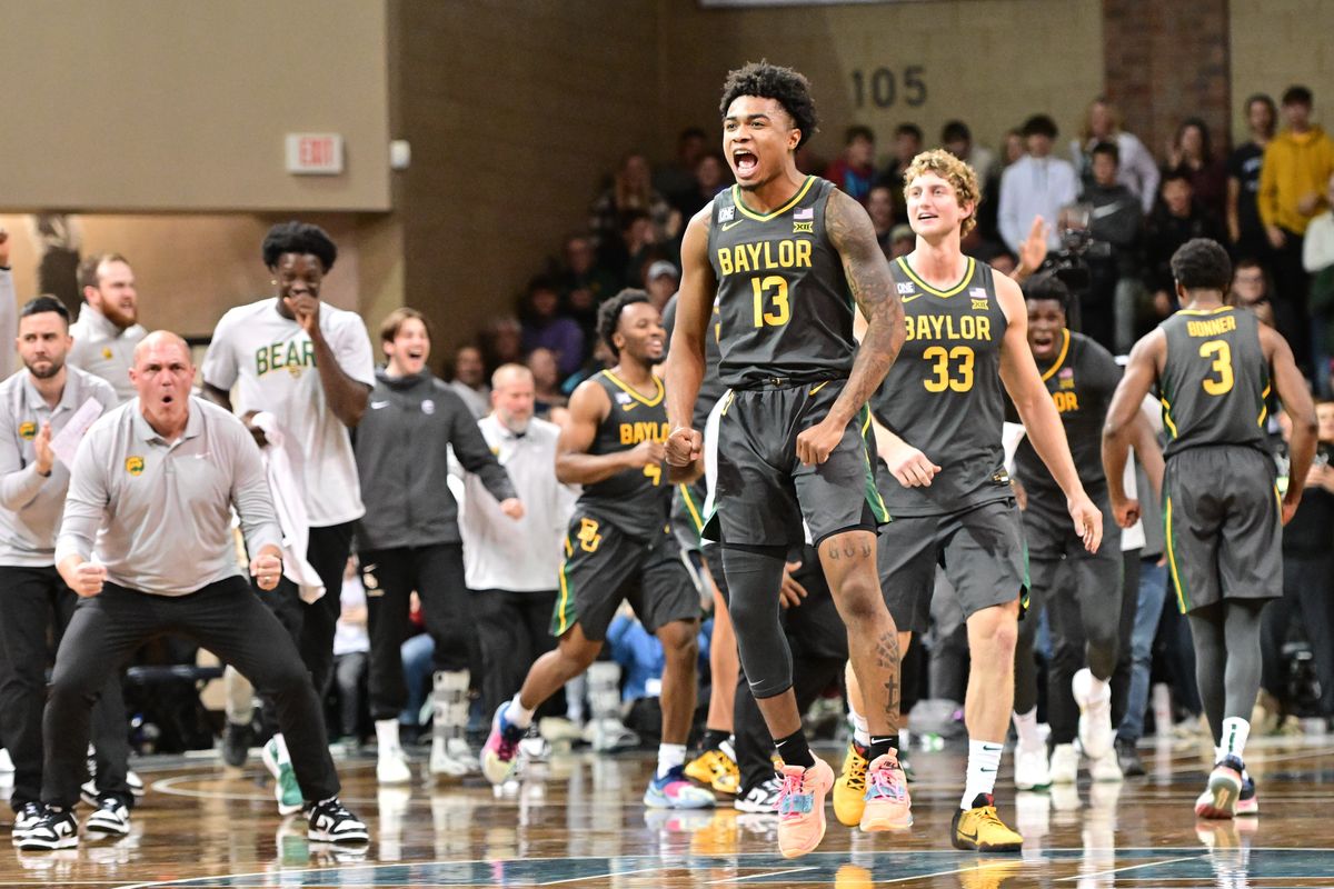 Baylor Bears guard Langston Love (13) and forward Caleb Lohner (33) celebrate after Baylor defeated the Gonzaga Bulldogs during the second half of a college basketball game on Friday, Dec. 2, 2022, at the Sanford Pentagon in Sioux Falls, S.D. Baylor won the game 64-63.  (Tyler Tjomsland/The Spokesman-Review)