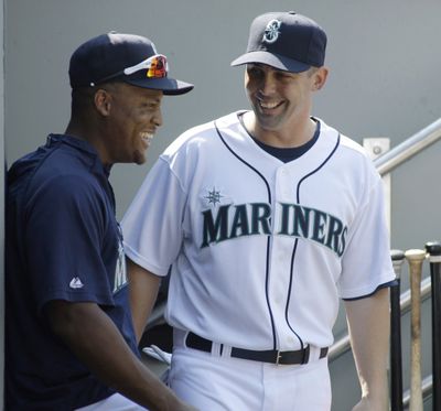 Adrian Beltre, left, visits with new Mariners shortstop Jack Wilson. (Associated Press / The Spokesman-Review)