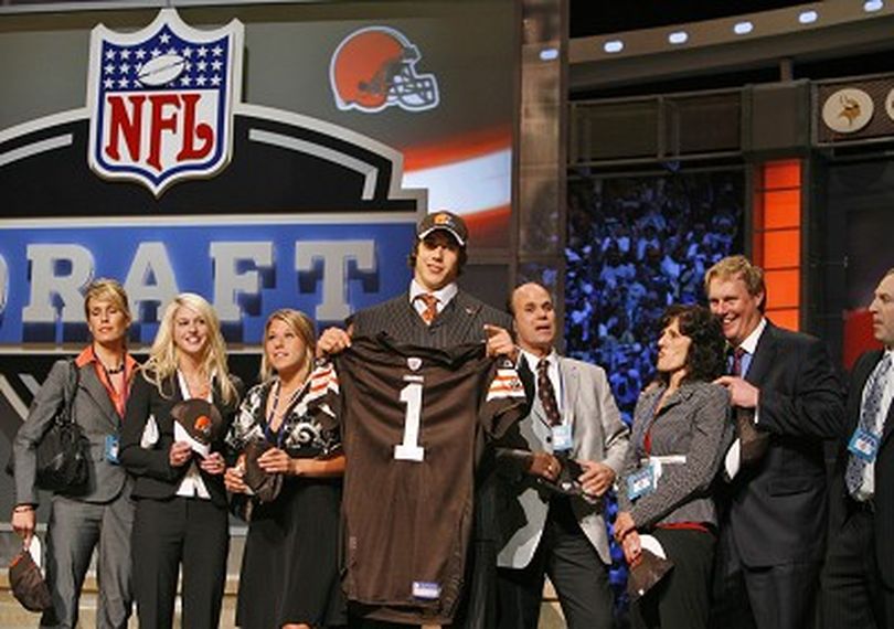 Brady Quinn, center, a quarterback from Notre Dame, holds a jersey while standing with family members after being selected 22nd overall by the Cleveland Browns during the first round of the NFL Draft, Saturday, April 28, 2007, at Radio City Music Hall in New York.  (AP Photo/Jason DeCrow) ORG XMIT: NYFF162 (Jason Decrow / The Spokesman-Review)