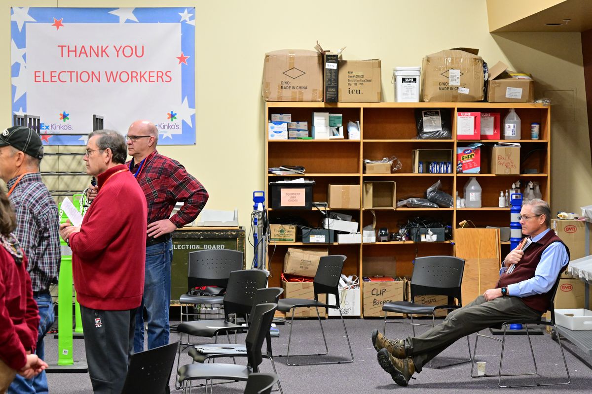 Republican Bob McCaslin, seated at right, who lost the Spokane County auditor’s race to Democratic incumbent Vicky Dalton, watches during a hand recount of votes for the Spokane County auditor’s race on Wednesday, Dec. 7, 2022, at the Spokane Elections Office in Spokane, Wash.  (Tyler Tjomsland/The Spokesman-Review)