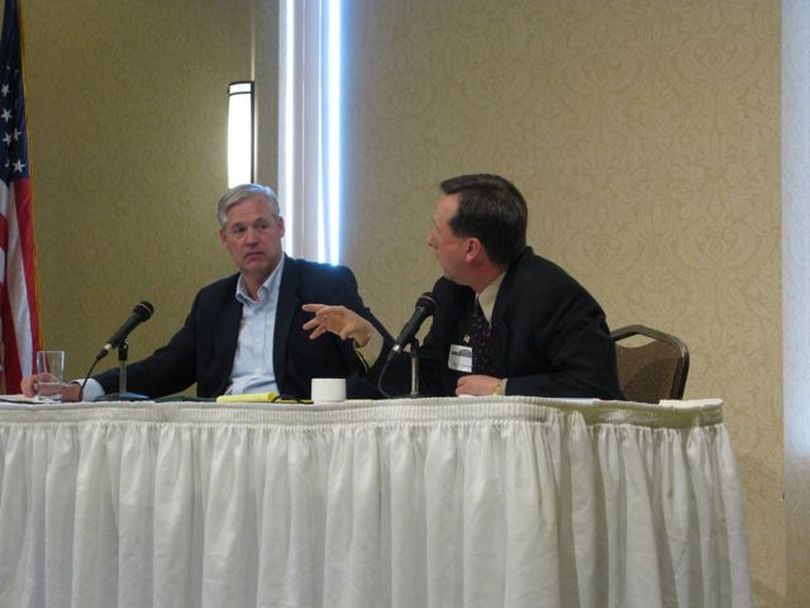 Idaho Democratic Party Chairman Larry Grant, left, and Idaho Republican Party Chairman Norm Semanko, right, clash during a Boise City Club forum on Monday. (Betsy Russell)